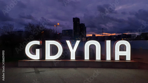 The inscription 'Gdynia' in the wharf at night, Gdynia, Poland