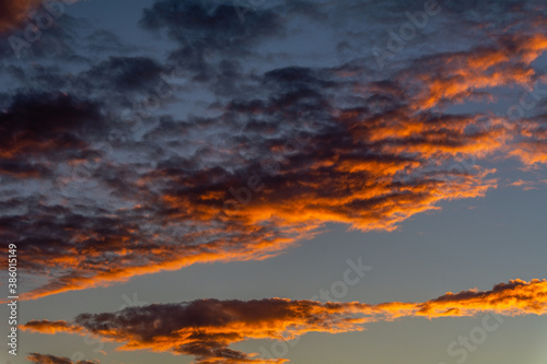 Sunset illuminating the clouds in the sky. © Senatorek