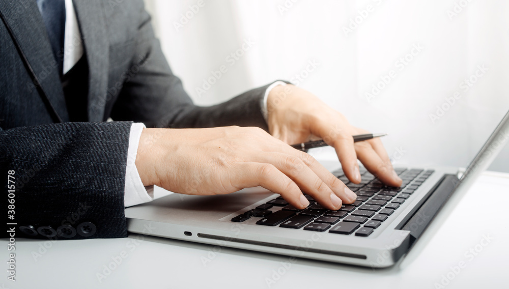 businesswoman hand using smart phone,mobile p payments online shopping,omni channel,digital tablet docking keyboard computer at office in sun light businesswoman hand using smart phone,mobile p payments online shopping,omni channel,digital tablet docking keyboard computer at office in sun light