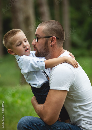 Father and son hugging in the park
