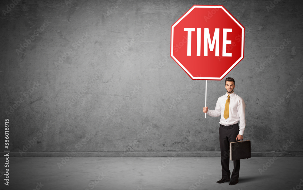 Young business person holding road sign with TIME inscription, new rules concept