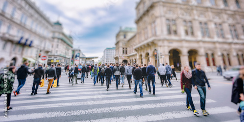Fototapeta Naklejka Na Ścianę i Meble -  Crowd of anonymous people walking on busy city street
