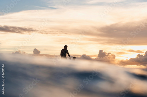 silhouette of a person surfing 