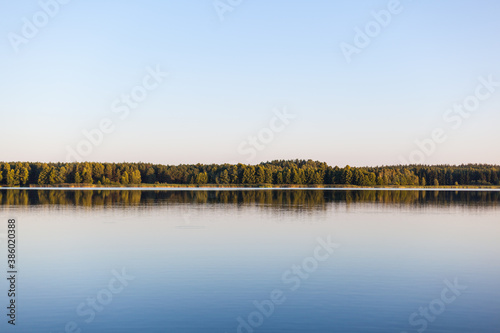 Calm lake surrounded by forest. Poland