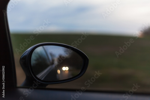 Looking into the exterior mirror of a car in a rural area Concentration Caution Insurance Fatigue Subsidy Reflection Passenger traffic Second sleep Responsibility Automobile