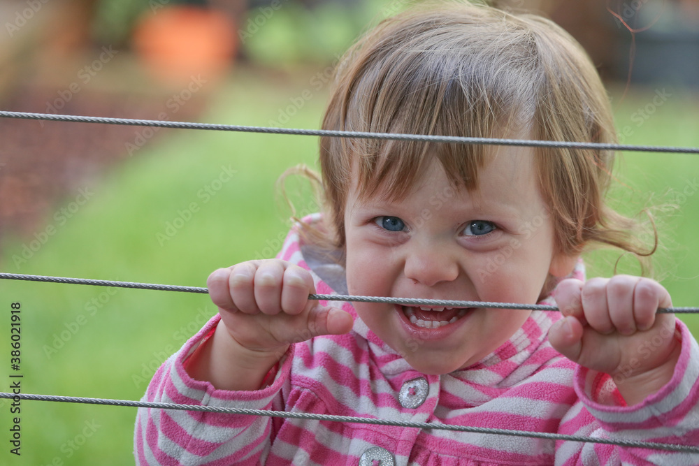 Close up Portrait of Cute 18 month Old Happy Toddler Girl with Big Blue Eyes and Curly Brown Hair. Adorable Baby Girl, Happy and Healthy Baby Close up Portrait of Cute 18 month Old Happy Toddler Girl with Big Blue Eyes and Curly Brown Hair. Adorable Baby Girl, Happy and Healthy Baby
