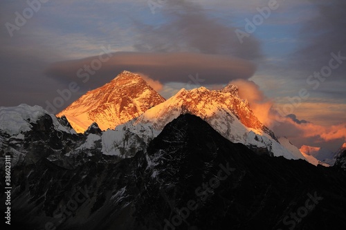 Scenic red sunset on Mount Everest Sagarmatha and Lhotse as seen from Gokyo Ri with cloud above Everest, Gokyo, Sagarmatha Khumbu Region, Nepal Himalaya