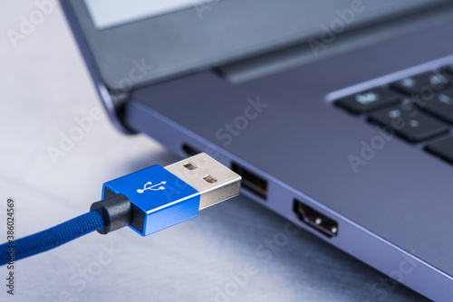 Usb cable ready to connection to laptop, data transmission concept