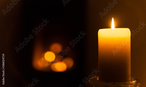 Фотография Christmas ambience with candlelight and a warming open fire home contemplation c