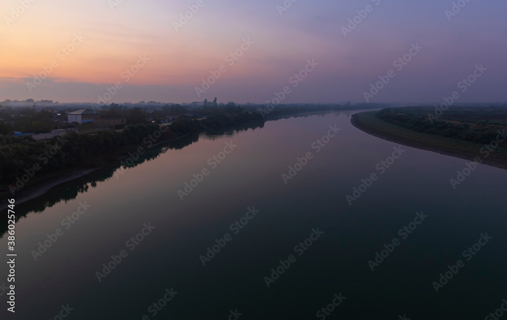 The Kura river flowing through the city of Neftechala at sunrise