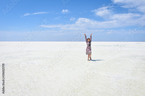 woman in dress on a white salt lake, portrait of a woman on a white salt lake