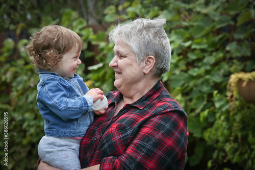 Happy Grandmother with Silver hair holding Little Cute 1 Years Old Granddaughter, October 2020, Portland, Oregon, Happy Family Concept