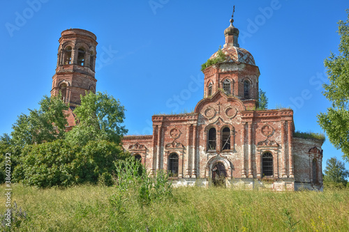 Old brick abandoned orthodox Church of the Trinity Church. abandoned Trinity Church in the village of Zasechnoye. abandoned red brick church in the thicket, abandoned temple in the field