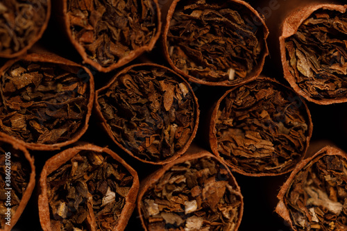 brown cigarettes in a pack close-up. horizontal frame photo