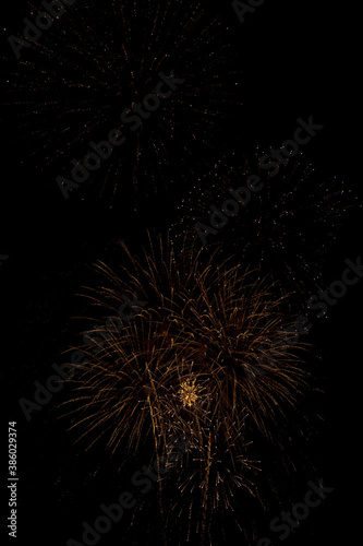 Colored fireworks on dark background texture. Surreal 