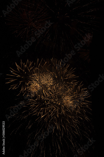 Colored fireworks on dark background texture. Surreal 