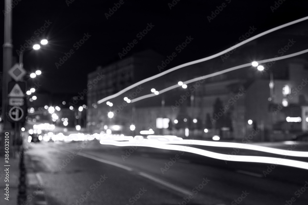 long exposure, light traces from traffic on the background of a night city