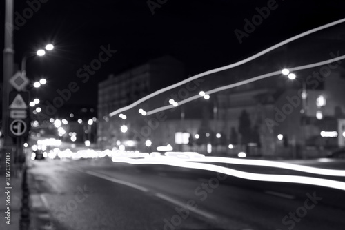 long exposure, light traces from traffic on the background of a night city