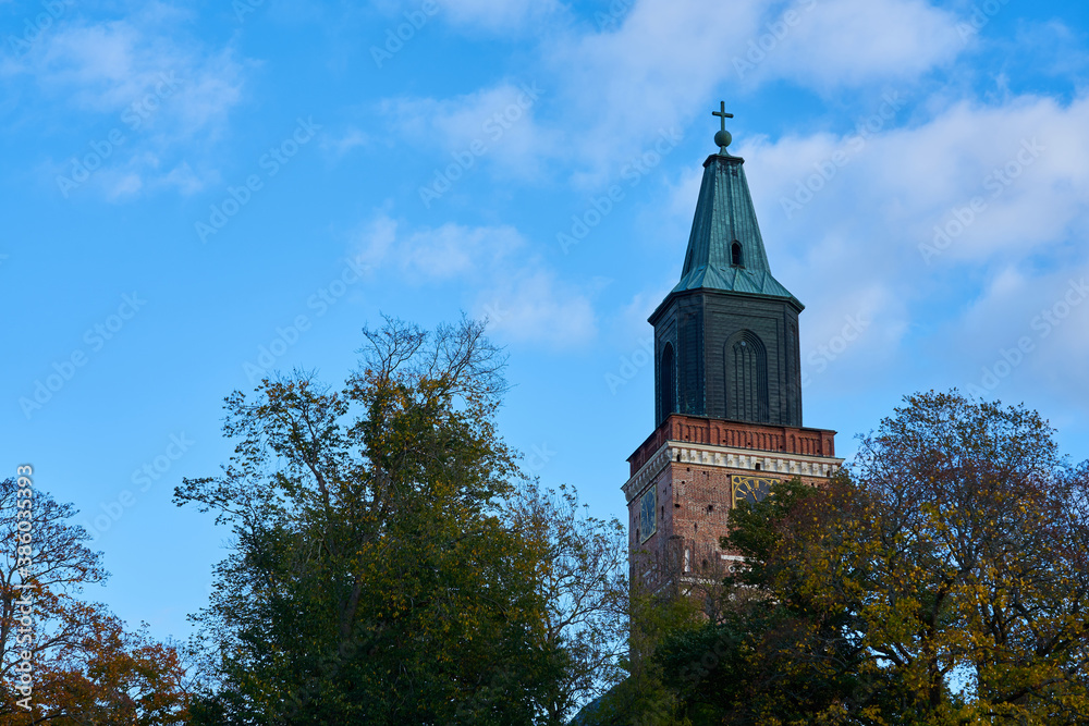 Turku Cathedral against a blue cloudy sky. Copy space.