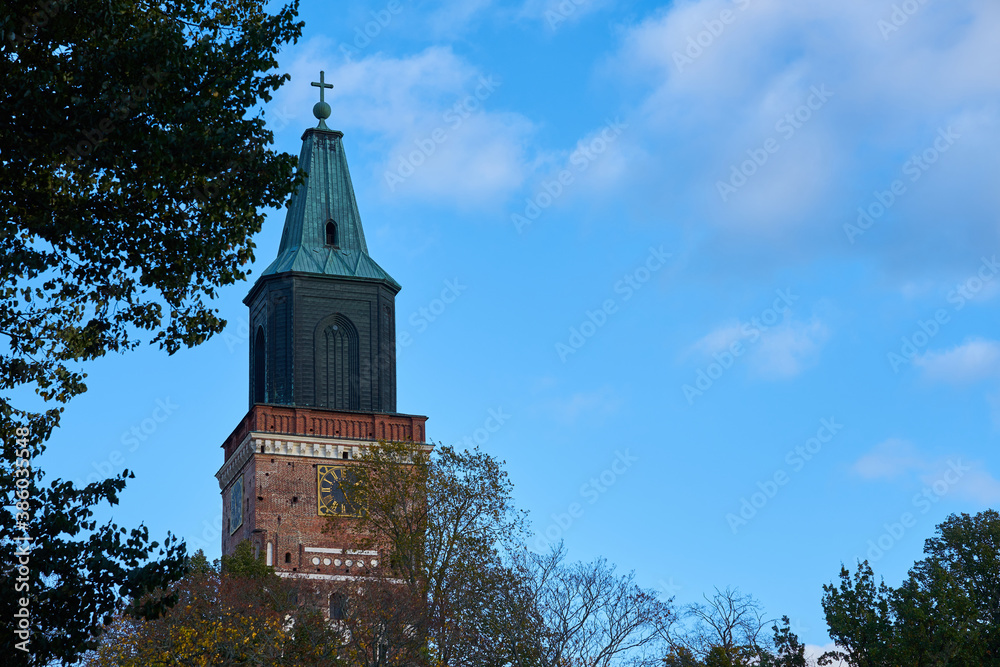 Turku Cathedral against a blue cloudy sky. Copy space.