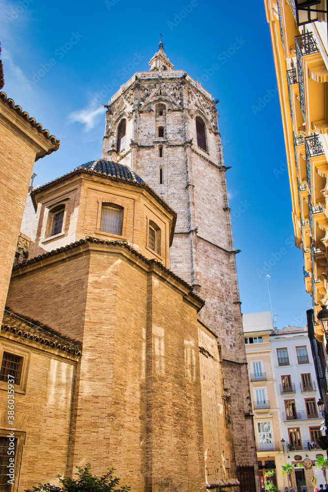 Street and side of the cathedral of Valencia with its bell tower of Micalet