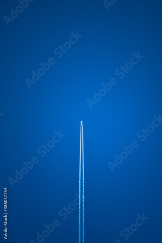 blue sky and airplane high in the air