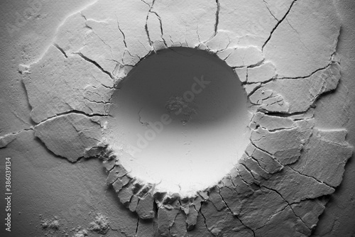 Obraz na plátne Round crater in black and white. A crater with cracks.
