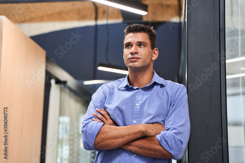 Businessman is standing and looking away