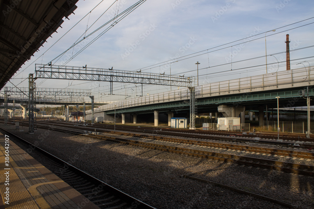 Urban landscape - railway station with rails and platform and road bridge in Moscow Russia Urban landscape - railway station with rails and platform and road bridge in Moscow Russia