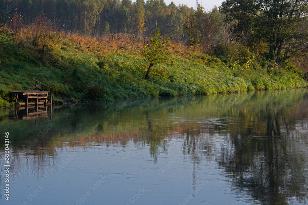 landscape - late fall, a yellow flame of bushes over the sleepy river landscape - late fall, a yellow flame of bushes over the sleepy river