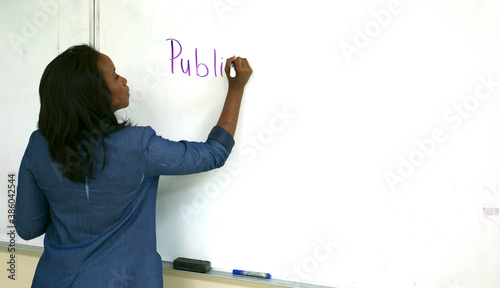 Beautiful African American woman teaches a college class on Public Speaking