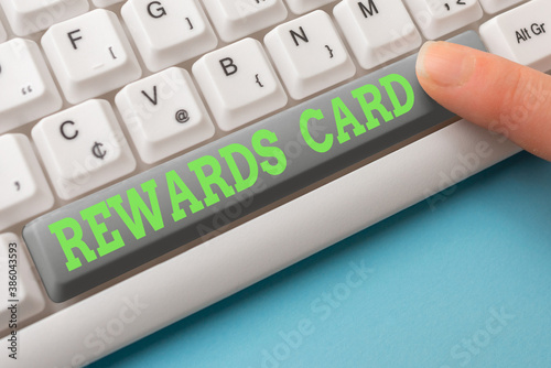 Word writing text Rewards Card. Business photo showcasing Help earn cash points miles from everyday purchase Incentives Different Colored PC keyboard key With Accessories on Empty background photo