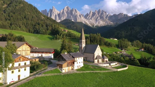 Aerial of the beautiful Santa Maddalena Church, Val Di Funes, Dolomites, Northern Italy