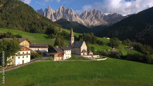 Aerial of the beautiful Santa Maddalena Church, Val Di Funes, Dolomites, Northern Italy