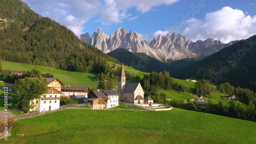 Aerial of the beautiful Santa Maddalena Church, Val Di Funes, Dolomites, Northern Italy