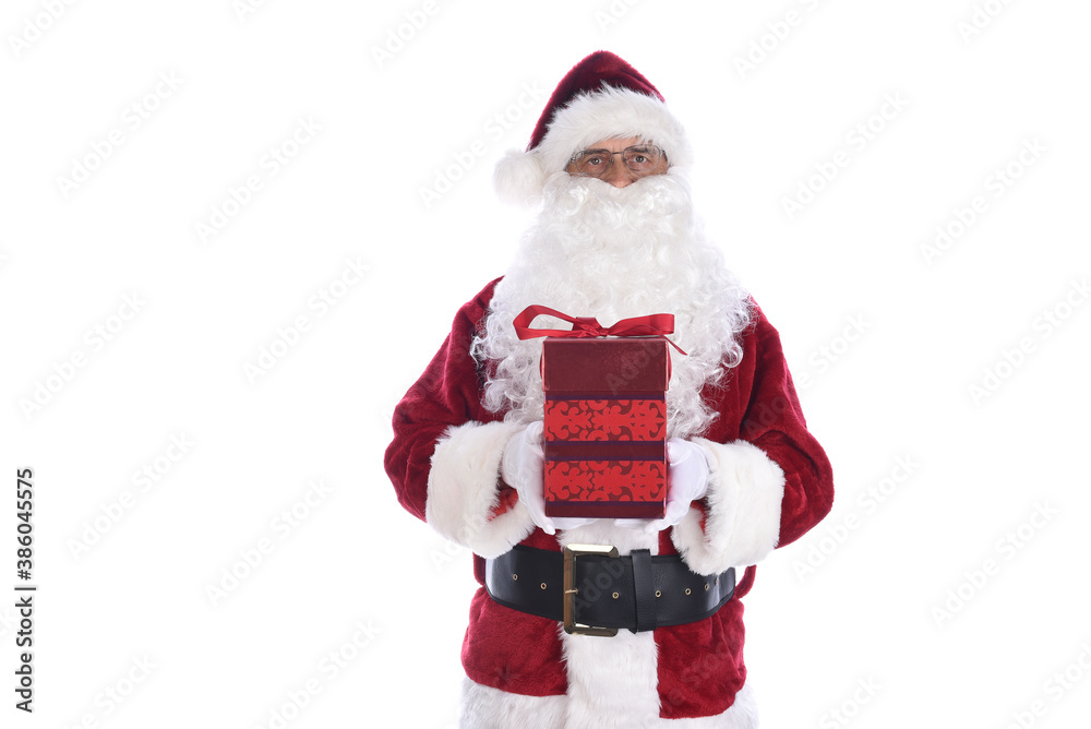 Senior man wearing a traditional Santa Claus costume holding a red gift box with bow. Isolated on white. Senior man wearing a traditional Santa Claus costume holding a red gift box with bow. Isolated on white.