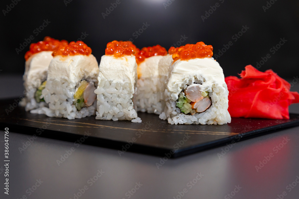japanese sushi food. Maki ands rolls with tuna, salmon, shrimp, crab and avocado. Top view of assorted sushi. Rainbow sushi roll, uramaki, hosomaki and nigiri. Assorted sushi japanese sushi food. Maki ands rolls with tuna, salmon, shrimp, crab and avocado. Top view of assorted sushi. Rainbow sushi roll, uramaki, hosomaki and nigiri. Assorted sushi