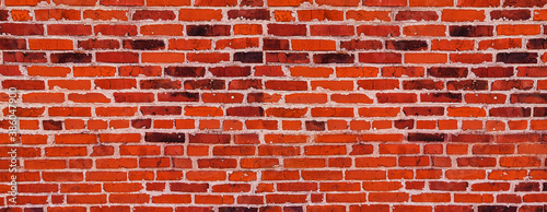 Red Brick wall of clinker bricks masonry - old brick wall of clay brick with cement seams