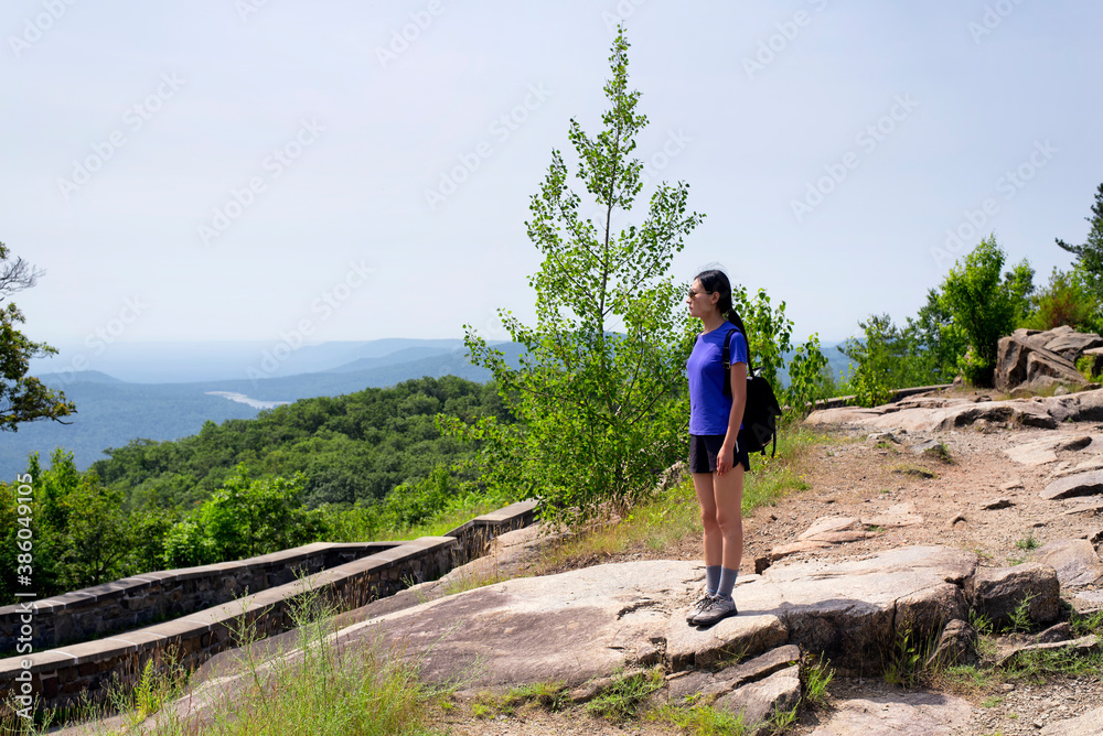 Fototapeta premium chinese woman on top of Prospect Mountain Lake George