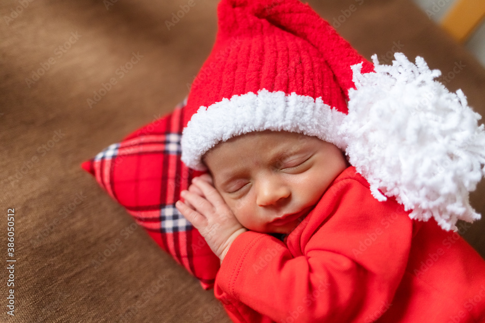 Cute newborn baby in Santa hat. Sleeping baby on a dark background. Closeup portrait of newborn baby. Baby goods packing template. Nursery. Medical and healthy concept. Christmas. New Year Cute newborn baby in Santa hat. Sleeping baby on a dark background. Closeup portrait of newborn baby. Baby goods packing template. Nursery. Medical and healthy concept. Christmas. New Year