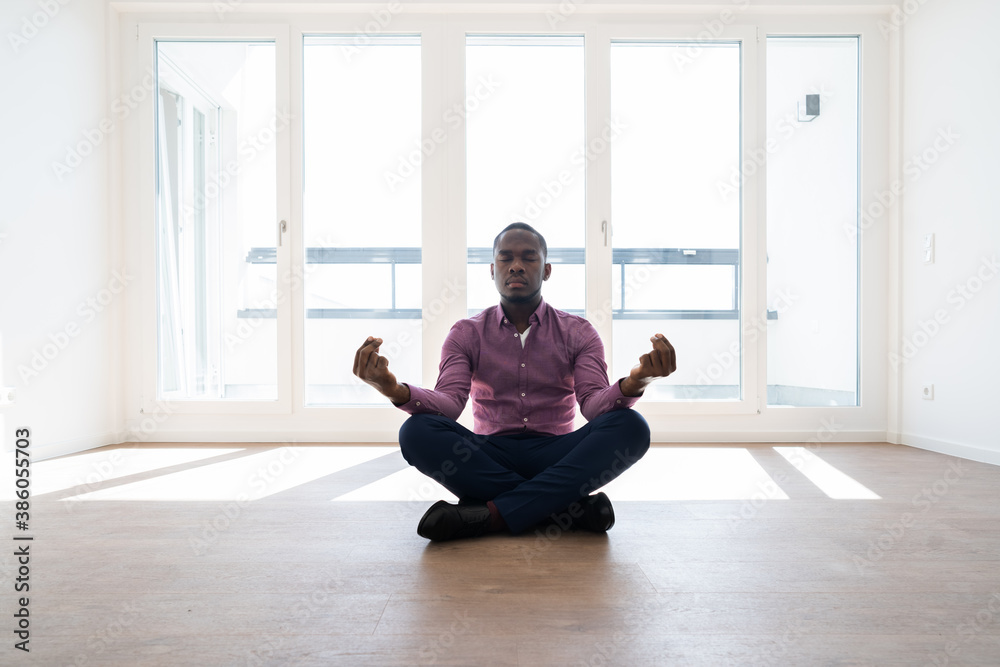 African American Man Meditating And Relaxing African American Man Meditating And Relaxing