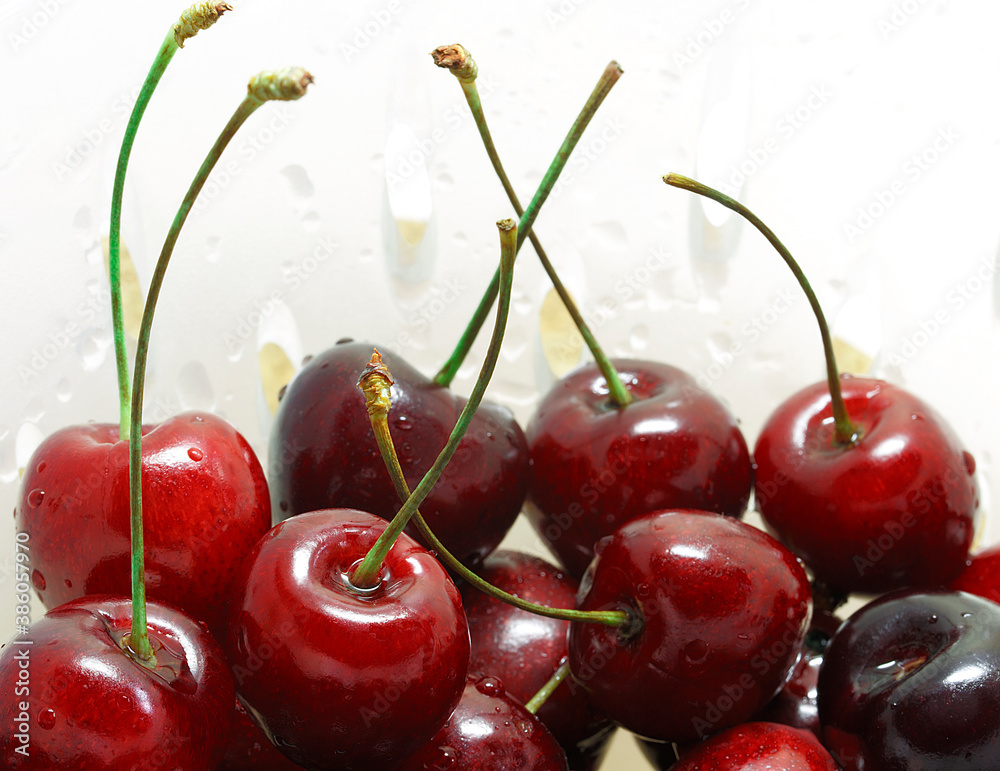 Cherry Background. A red cherries on a grey background, Fresh and ripe cherry berries, macro image, selective focus