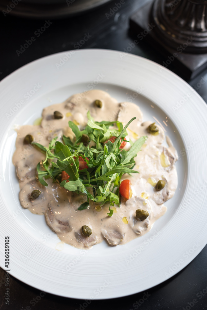 Chilled Veal in Tuna-Caper Sauce with Fresh Arugula Leaves, Italian Vitello Tonnato Chilled Veal in Tuna-Caper Sauce with Fresh Arugula Leaves, Italian Vitello Tonnato