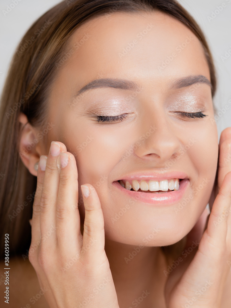 Beautiful and healthy skin. A young woman is happy and uses natural cosmetics Beautiful and healthy skin. A young woman is happy and uses natural cosmetics