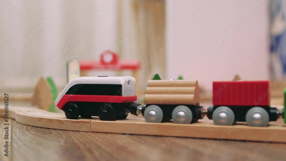 Wooden railroad on floor in nursery playroom
