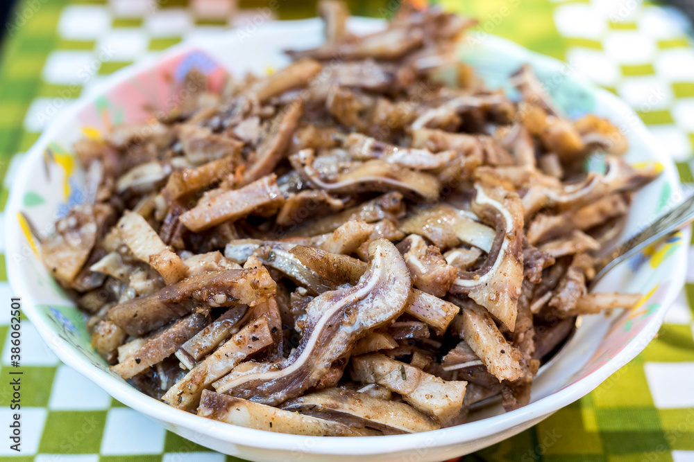 A cooked dish made from pork ears. Delicacy. The dish is on our table. A cooked dish made from pork ears. Delicacy. The dish is on our table.