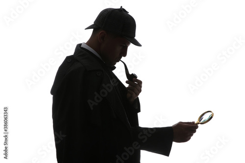 Old fashioned detective with smoking pipe and magnifying glass on white background