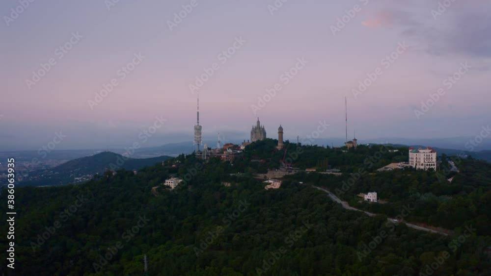 Aerial view on Tibidabo mountain with Collserola TV tower in Barcelona city Aerial view on Tibidabo mountain with Collserola TV tower in Barcelona city