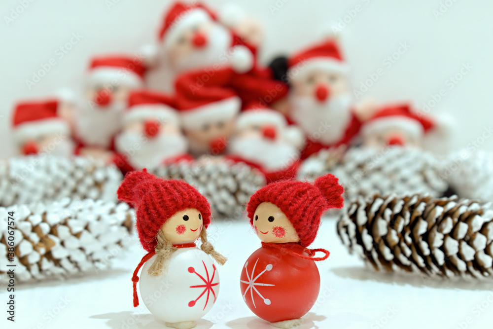 funny toys close up on a blurred background of santa claus toys and fir cones