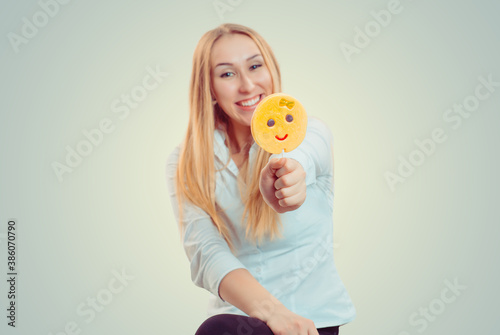 Happy woman holding giving stick with emoji